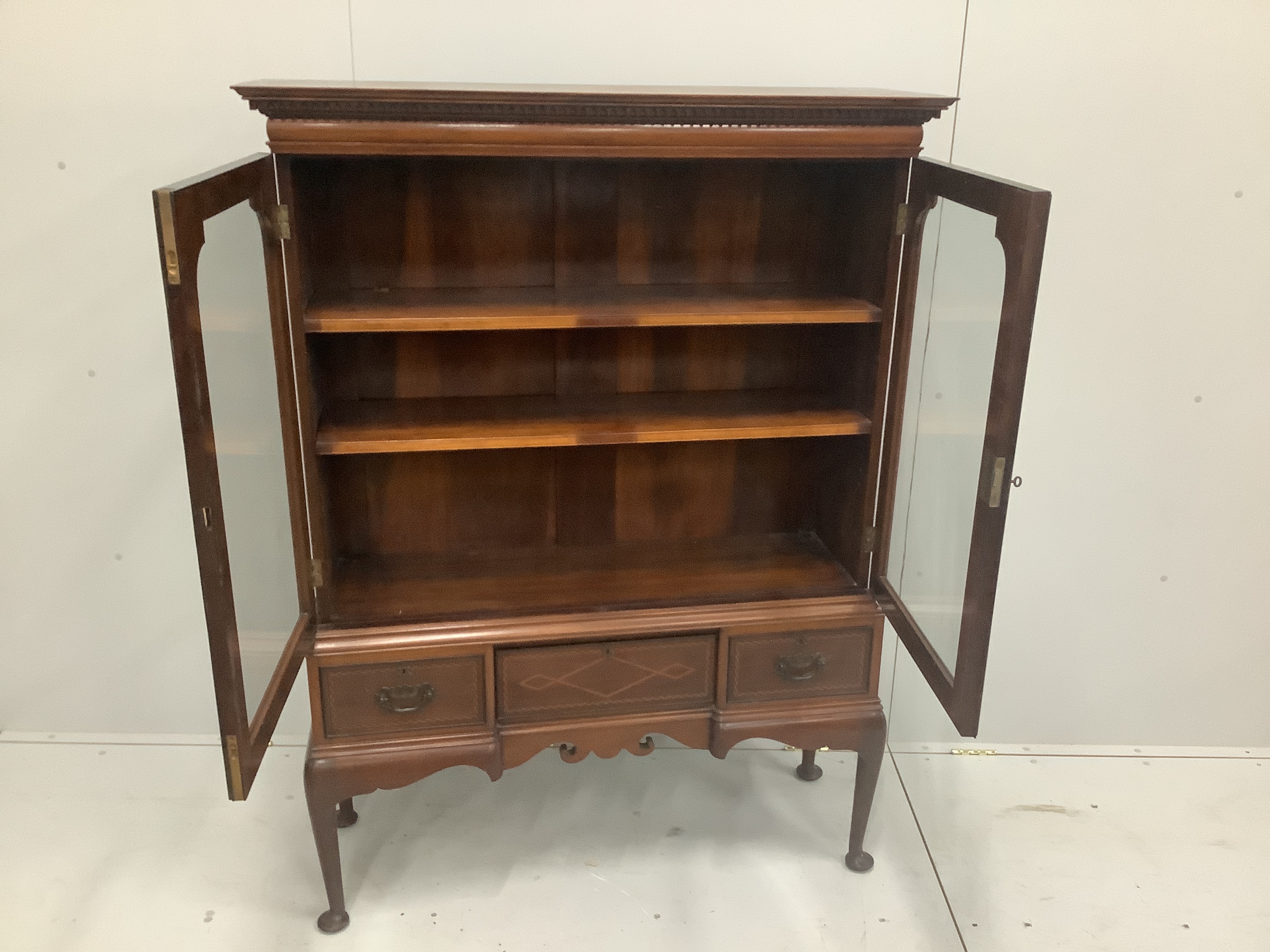 An Edwardian inlaid mahogany bookcase, width 112cm, height 152cm